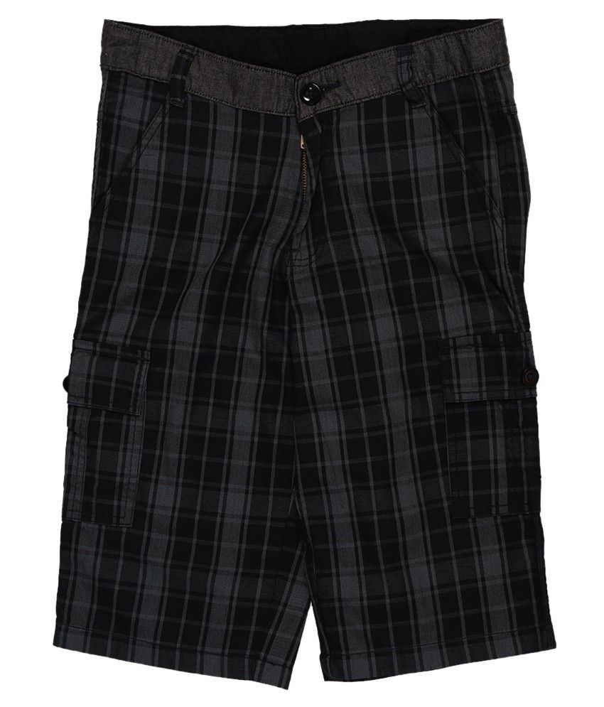 Black shorts for kids Black competition shorts have a colored, wide fold-over waistband tacked at the sides for stay-put style during movement. Banded leg bottoms keep shorts in place. Imported.