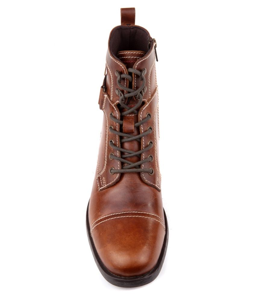tan boots with red zipper