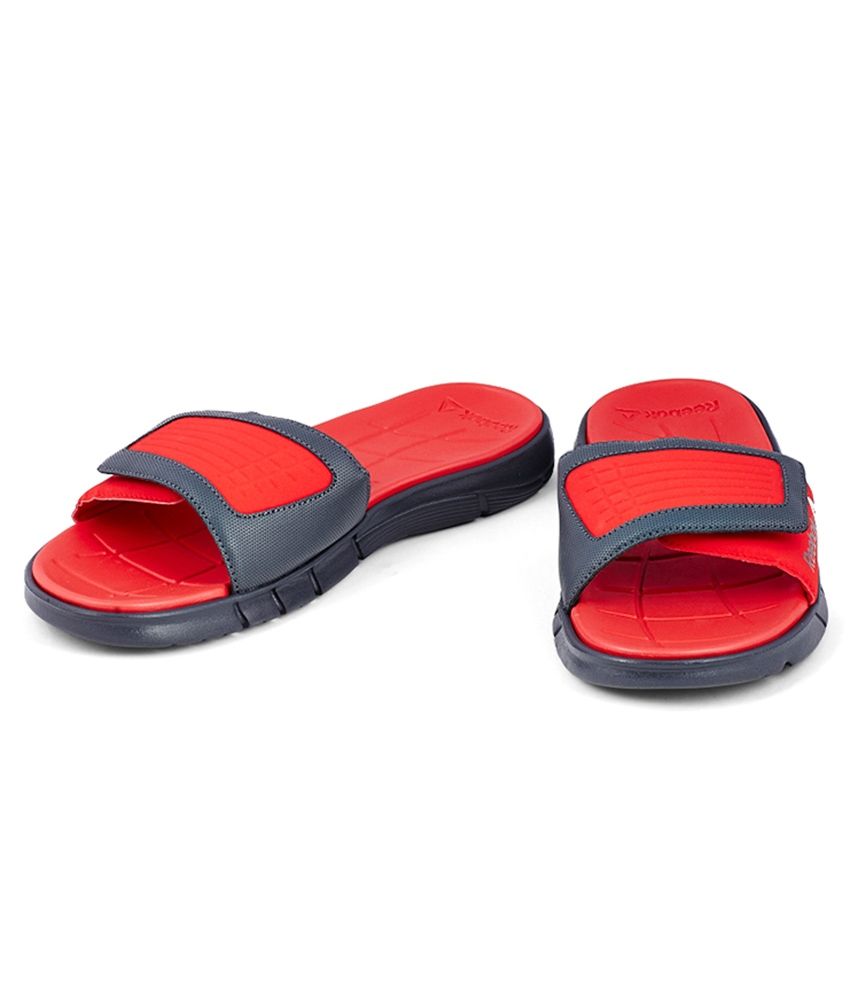 red reebok slides