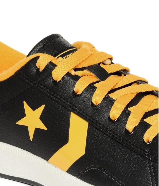 black and yellow leather converse