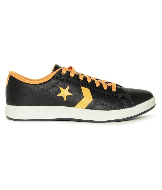 black and yellow leather converse