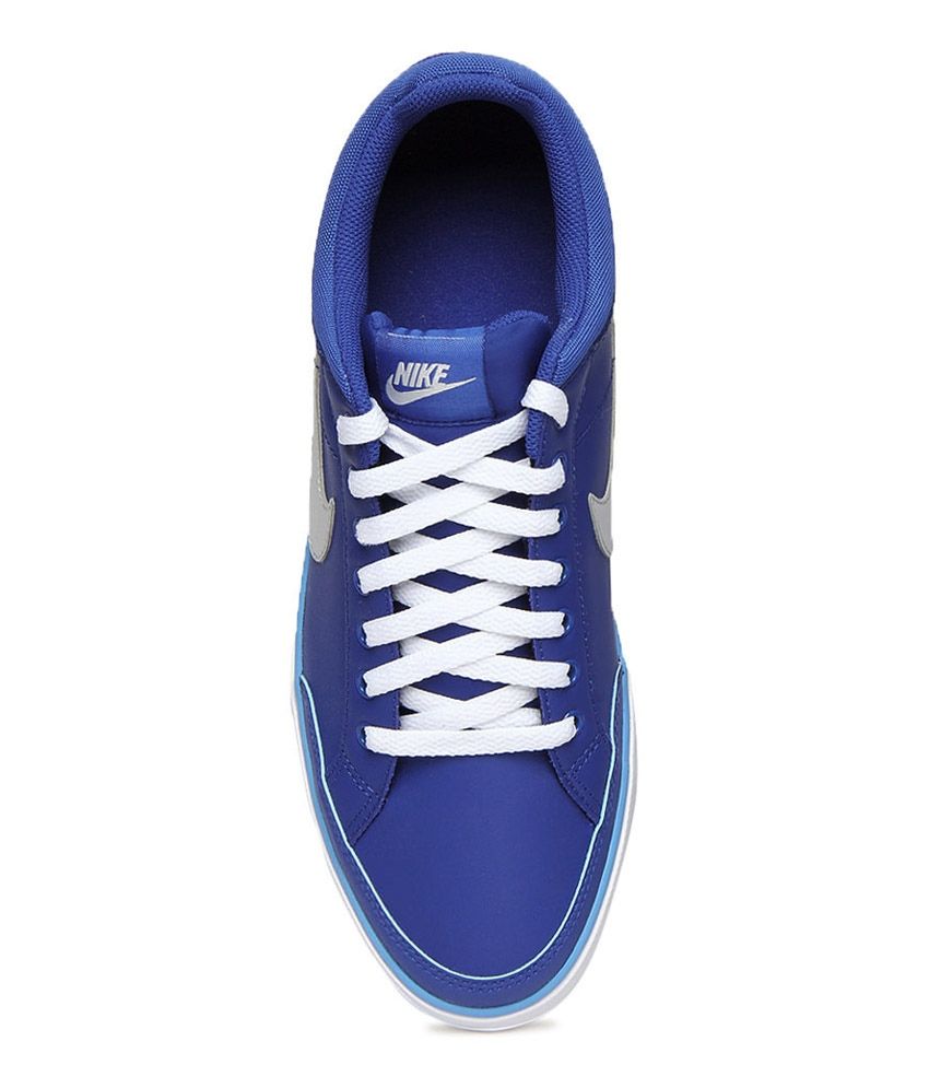 white nike shoes with blue check