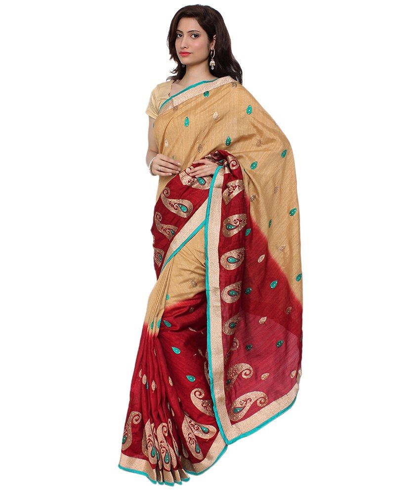 golden color saree with red blouse