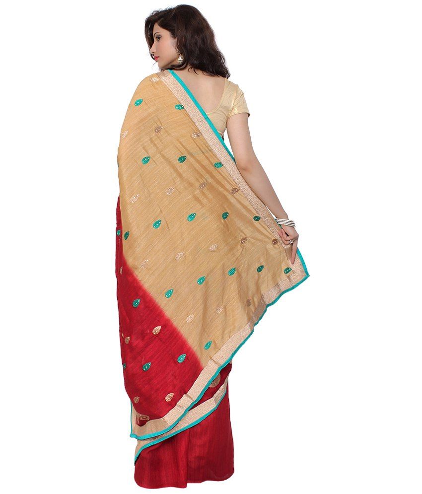 golden color saree with red blouse