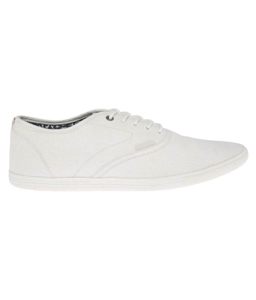robbie jones white sneakers