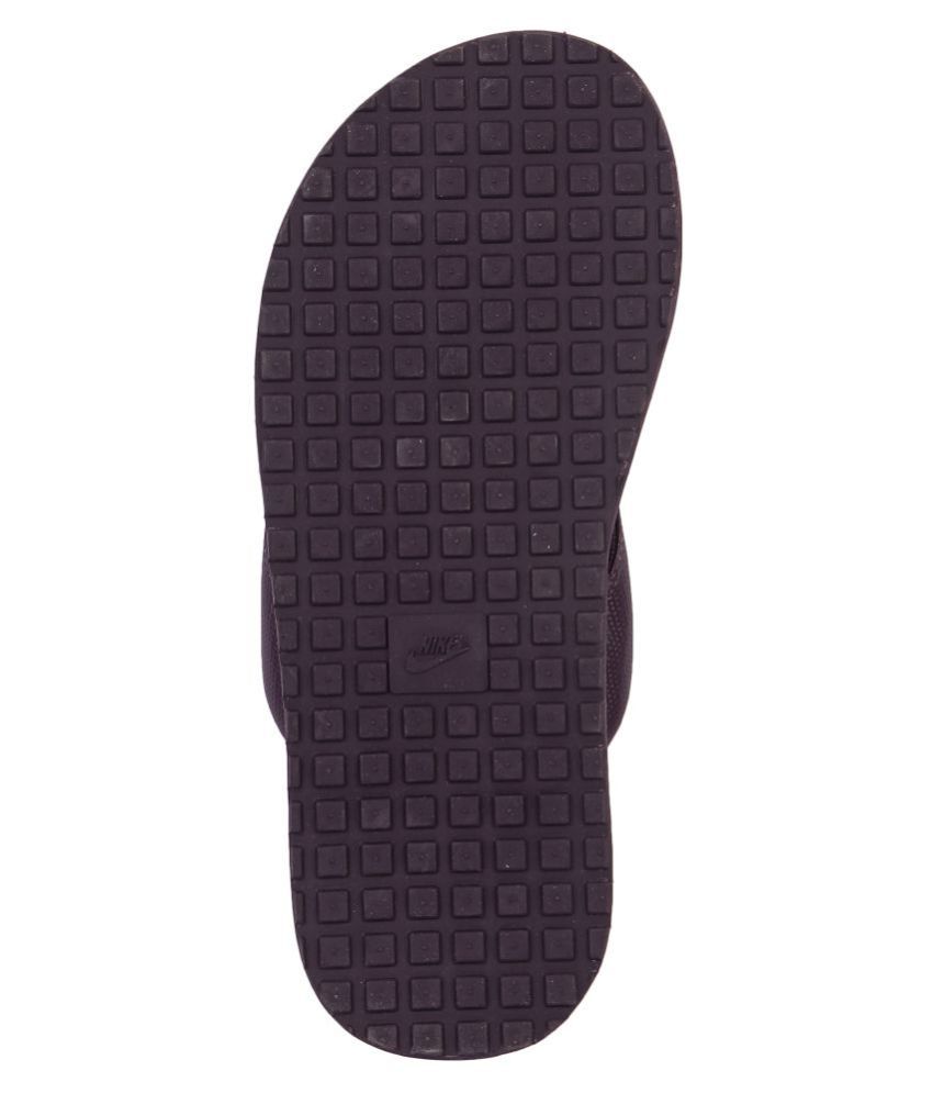 purple nike flip flops