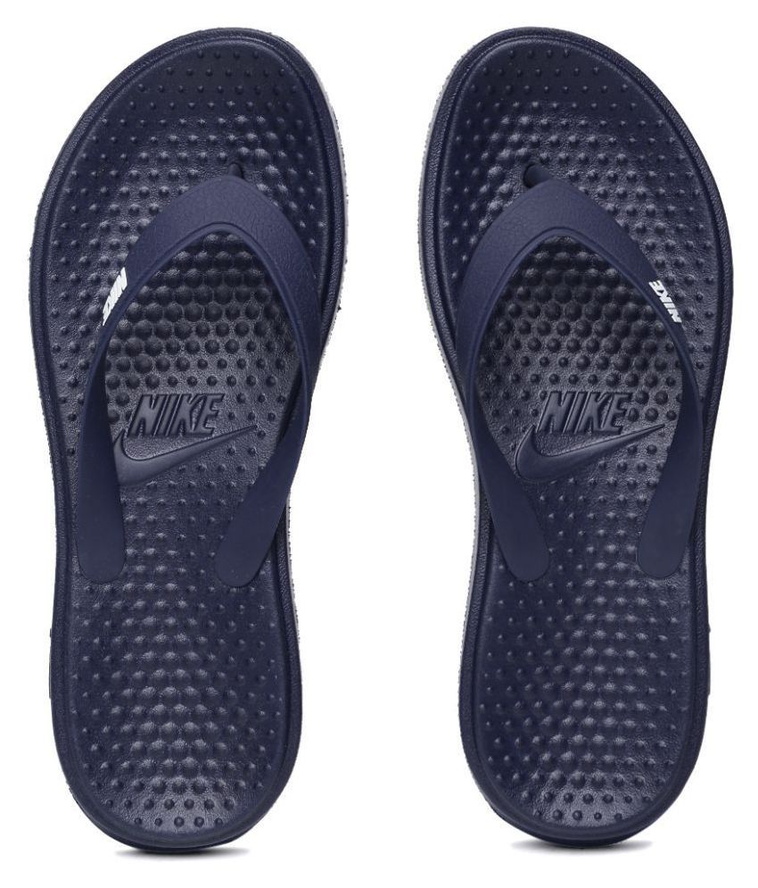 navy blue nike flip flops