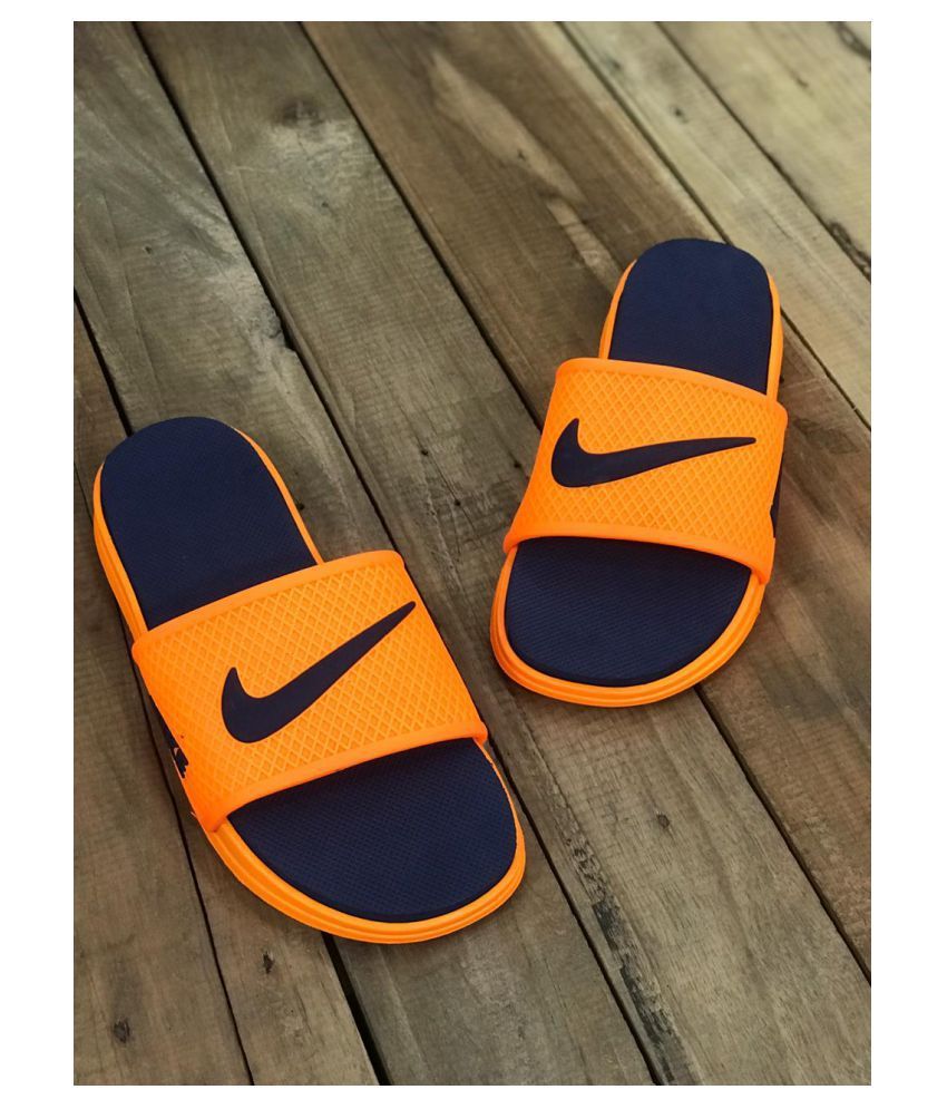 orange and blue nike slides