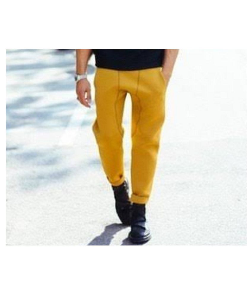 mustard track pants